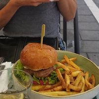 vegan burger with beyond meat and beetroot hummuss toast  at Brunch Republic in Trieste