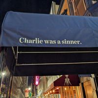 Sign outside at Charlie Was a Sinner in Philadelphia
