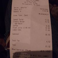 receipt showing 11 dollars for a slice of dry nasty cake and 8 dollars for a glass of orange juice at Charlie Was a Sinner in Philadelphia