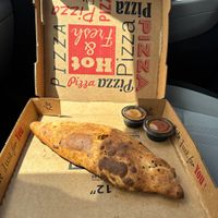 Vegan calzone with marinara and their sweet chili sauces!  at Lazy Moon Pizza in Orlando