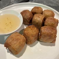 A rare vegan treat! Crispy on the outside, filled with minced tofu skin and crunchy water chestnuts. Perfect with sweet plum sauce – a true taste of Chinese comfort.  at So Vegan - Phoenix Pratunam in Bangkok