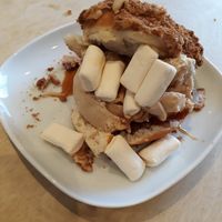 Biscoff donut crammed with Biscoff ice cream and marshmallows drizzled with caramel sauce at Considerit in Edinburgh