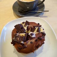 Creme egg doughnut made with broken pieces of creme egg bar at Considerit in Edinburgh