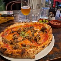 Parmigiana with vegan cheese. Smoked almonds and olives at The Pizzeria in Fort William