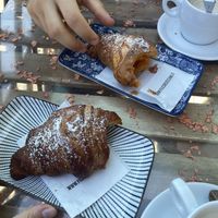 Plain vegan croissant and marmelade vegan croissant with soy cappuccino  at Caffè Bertini 32 in Bologna