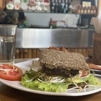 Pesto burger with onion bread  at The Seeds of Life in Ubud