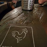 Logo chicken onnapkin at Poule&Poulette Brugge in Bruges