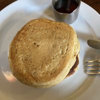 Stack of 3 pancakes with maple sirup   at Cherry Reds Cafe and Bar in Birmingham