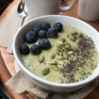 matcha porridge with blueberries and chia/pumpkin seeds. ordered without banana. at Cherry Reds Cafe and Bar in Birmingham