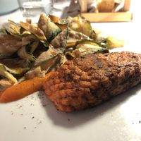 3D-printed plant-based “salmon” fillet, served with sautéed vegetables, crispy nori seaweed, and sweet & spicy mango sauce  at Ristorante Frontemare in Veneto