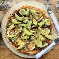 Super Vegano pizza - 60Q. With a side of fries this was a good sized meal for two people  at Maria's Restaurant in San Pedro La Laguna