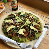 Tandoori tempeh & pesto pizza   at Maria's Restaurant in San Pedro La Laguna