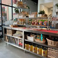 Inside the space, with some cute snacks showcasing lots of cookbooks at Little Kim in Ann Arbor