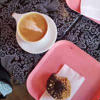 Chocolate Peanutbutter donut with coffee at Glam Doll Donuts - Eat Street in Minneapolis