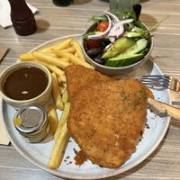 Plant based schnitzel with vegan gravy & chips.  at Eyre Hotel in Whyalla