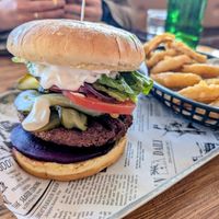The Vegan burger with beetroot & extra pickles. August 2025. at The Burger Hub Tas in Rosny Park