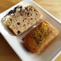 More scrumptious takeaway vegan treats; banana cake, and halawa (halva) and pistachio. at The Cheeky Pea in Kingston Upon Thames