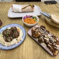 Vegan chicken wrap with lots of different salad.  Houmous falafel bowl, and crispy battered cauliflower   at The Cheeky Pea in Kingston Upon Thames