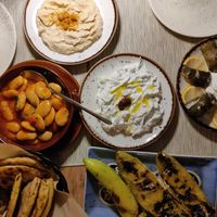 Hummus, giant beans, pita, dolmades (other dishes are tzatziki and feta filled peppers - vegetarian, not vegan) at Louis Family Restaurant in Rhode Island