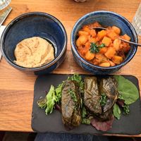 Express lunch menu - dip (houmous) and two dishes (pitta not in photo) - fasolia karavisia and dolmades at Halloumi Glasgow in Scotland