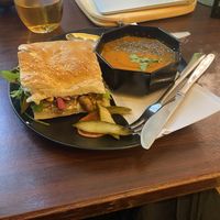 tomaten harissa soep, brood met labneh met gecarameliseerde ui en champignons  at Café Gilde in Amsterdam