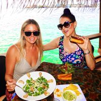 That is a chicken salad on the left that my friend is eating. Fish is also on the menu. Vegan food is the majority. I am eating the vegan panini, salad & guacamole on the right. at Leaf Eaters Cafe in Bocas Del Toro