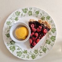 chocolate and raspberry tart with mango ice cream at Chat-Rivari Café in Paris
