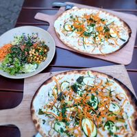 Dinner two flamkuche with cococnut yoghurt and salad on the side at L'Acoustic in Selestat