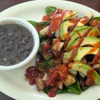 Side of black beans(they don't use meat broth or lard!), raw spinach, home fries, and avocado. at Food Bash in Winchester