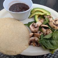 Order these sides to make tacos! Black beans, avocado, corn tortillas, uncooked spinach & mushroom. Cut up the mushrooms & mix them into the hot beans to soften & soak up flavor! at Food Bash in Winchester