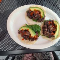 Order these sides to make tacos! Black beans, avocado, corn tortillas, uncooked spinach & mushroom. Cut up the mushrooms & mix them into the hot beans to soften & soak up flavor! at Food Bash in Winchester