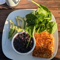 Hash Brown, black beans, side avocado, and raw spinach. at Food Bash in Winchester
