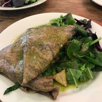The Herbivore: vegan buckwheat crepe with tempeh, mushrooms, and caramelized onions served over salad.  at Starving Artist Creperie and Cafe in Lee