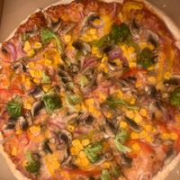 Thick crust pizza with vegan cheese at Woodstone Pizza & Flamegrill Keswick in England