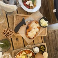 Kapreza salad, fucassia, and shakshuka  at Anastasia in Tel Aviv