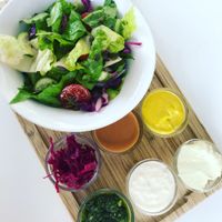 Amazing breakfast plate with six vegan dips and homemade bread at Anastasia in Tel Aviv