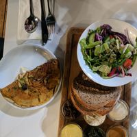 Breakfast with chickpea omlete  at Anastasia in Tel Aviv