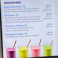 Wall sign for smoothies (v= vegan) at Just Salad - Lenox Hill in New York City
