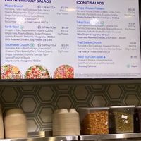 Wall sign (V = vegan) at Just Salad - Lenox Hill in New York City