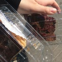 Chocolate raspberry layered cake and pastry slice with chocolate on top at Newen Vegetariano in Santiago