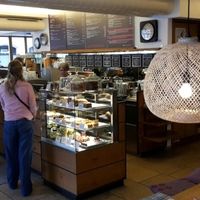 Counter and cake section to the right lots of options on menu board at Das Voglhaus in Konstanz