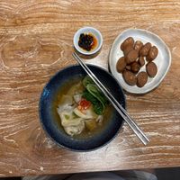Dumpling soup with extra vegan sausage! Delicious!!! And that chili oil is my favorite too!! at Lao Ba Cha in Bali