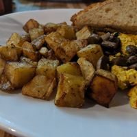 Generous portion of tofu scramble with crisp potato and gluten free toast. at Black River Cafe in Oberlin