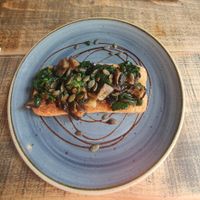 Garlic Mushrooms On Rustic Toast (VE) Roasted mushrooms with spinach on toasted rustic ciabatta. at The Bank in England