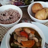 Okra and butter beans.   Jerk tofu and spicy kale .. fried dumplings.. peas and rice  washed down with apple and beetroot juice at Fi Real in Bristol