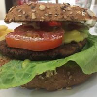 Kobus burger on oat bagel. Yummy!! at Konu Bar in Buenos Aires