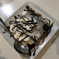 Warm brownie with cream  at Konu Bar in Buenos Aires