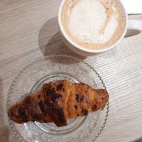 Chocolate croissant, cappuccino at Sansa Café in Sevilla