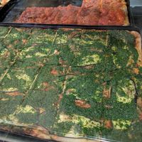 Foccacia with tomato sauce (back) and tomato sauce, eggplant and pesto (front) at La Focacceria in Berlin