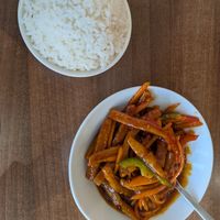 Sweet and spicy Szechuan dish with crispy shredded beef at Lotus Plant Based Kitchen in Manchester